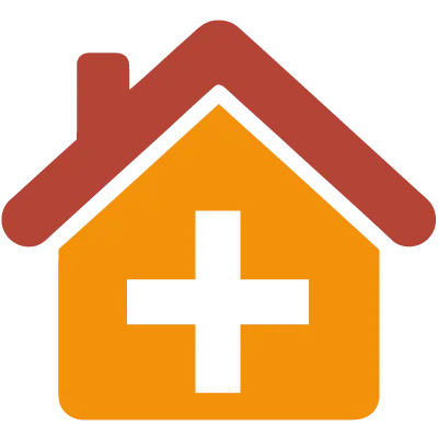 Orangenes Haus mit rotem Dach und schwarzem Kreuz in der Mitte