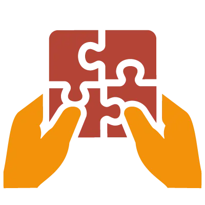 Zwei orangefarbene Hände halten vier zusammengefügte Puzzleteile